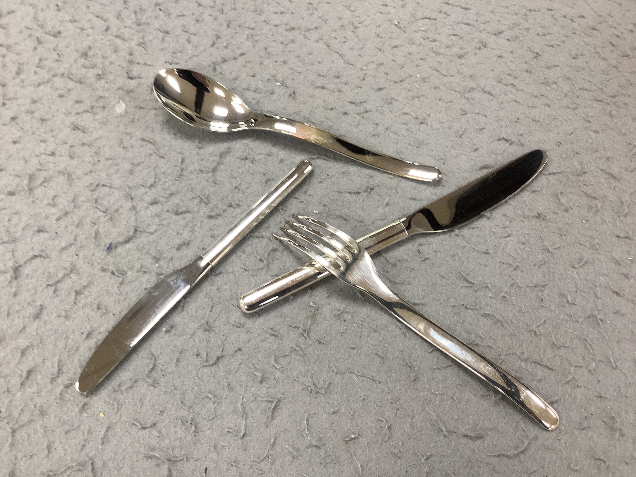 A Cristofle silver plated canteen of cutlery, comprising 84 items, in two trays.